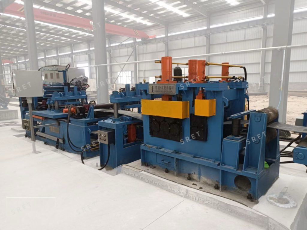 Strip-end flattener for coil preparation in an ERW tube mill line