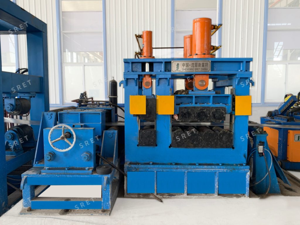 Strip-end flattener for coil-end preparation in an ERW tube mill line